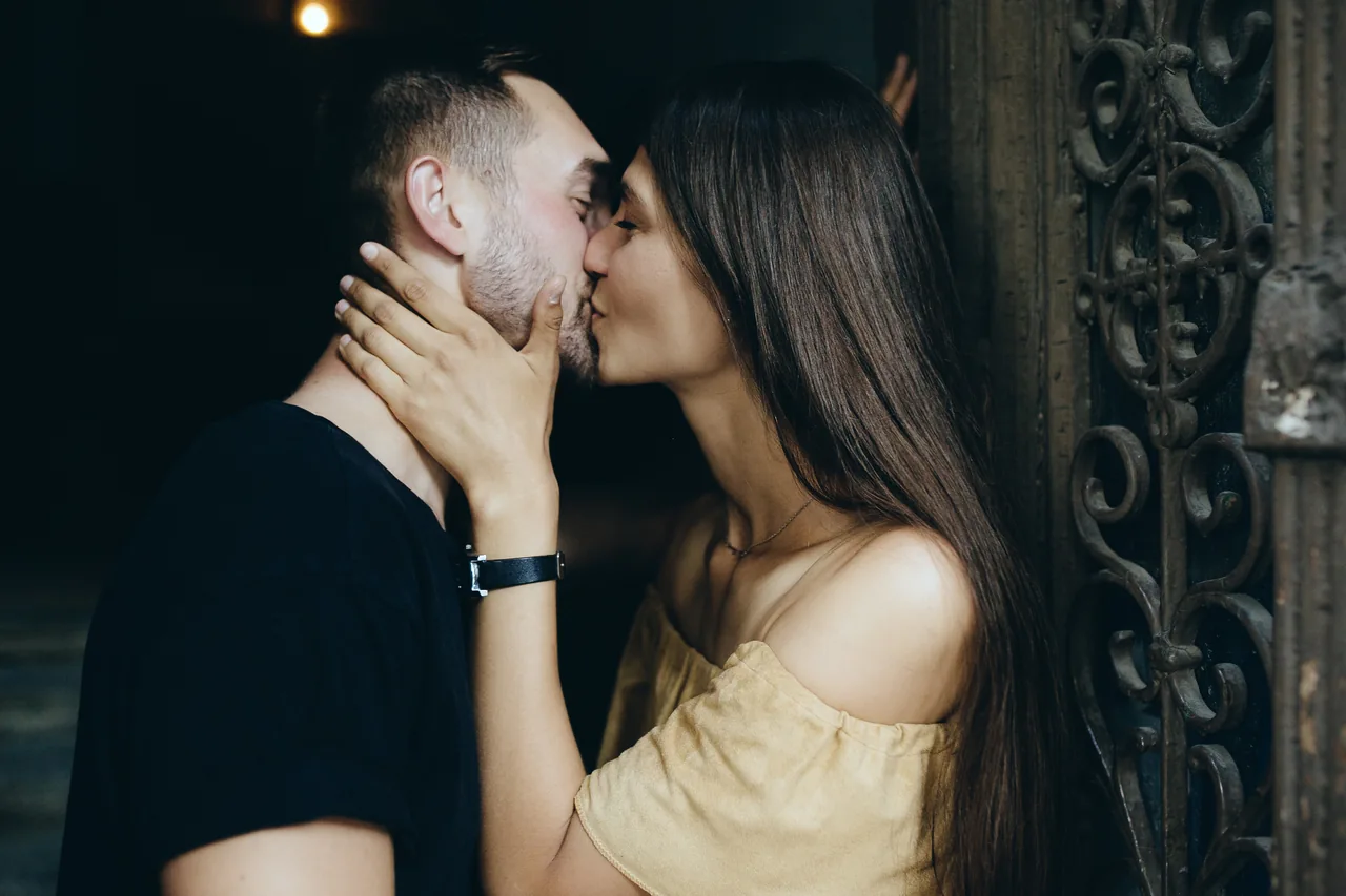 Two adults leaning close during an evening together, illustrating Hookup Dating with Herpes: Make the Choice Mutual
