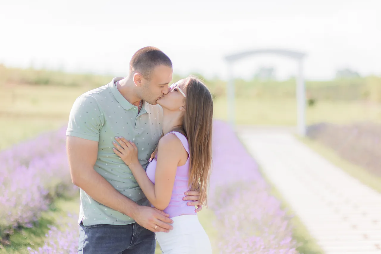 Two adults embracing in a flowering field, illustrating Serious Herpes Dating: Build a Lasting Partnership