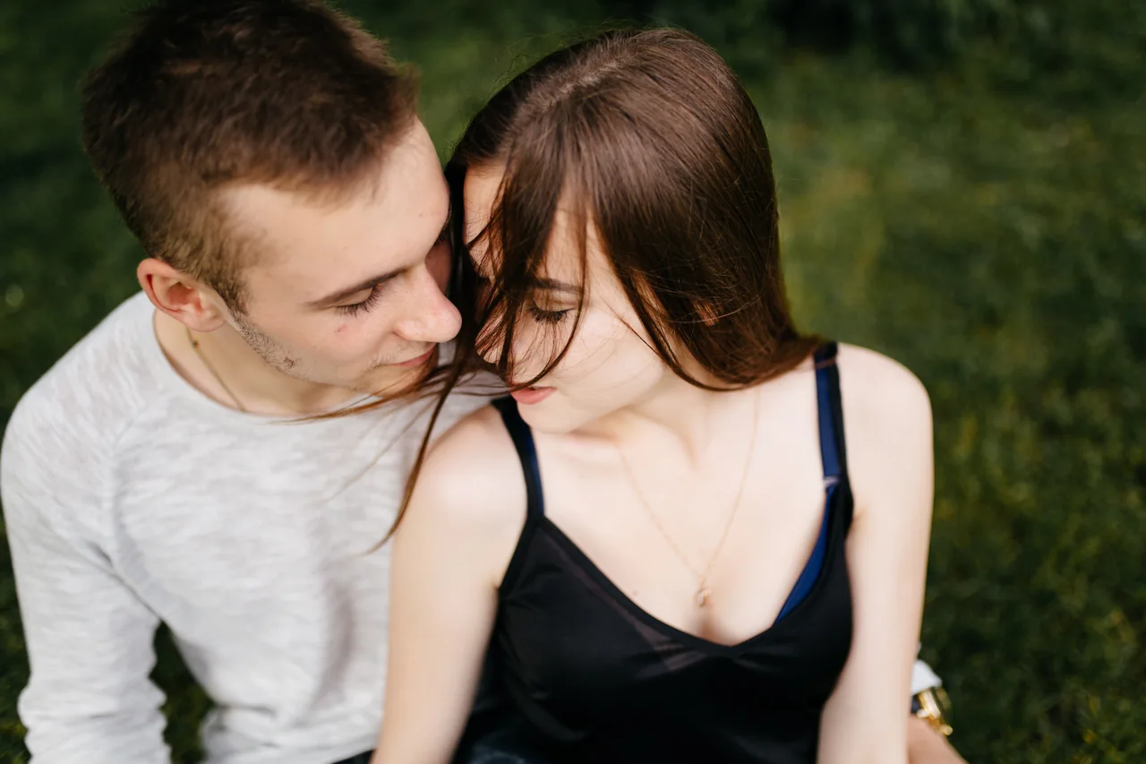 Two adults leaning toward each other outdoors, illustrating Meet HSV-1 Singles for Dating and Connection
