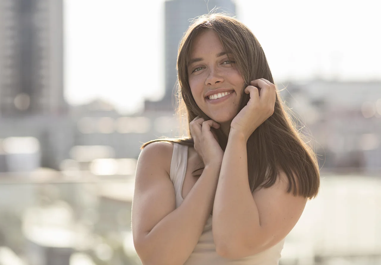 Promotional phone composition with a smiling adult woman for the HSV dating app