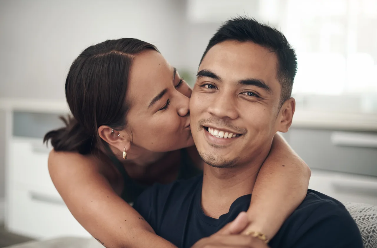 A cheek kiss and a warm smile, a romantic scene for Latino HSV dating