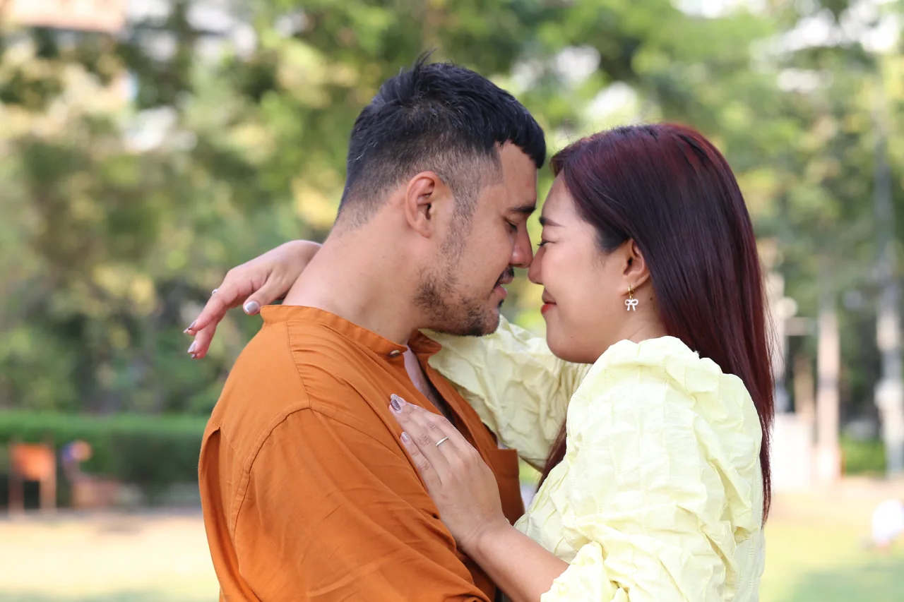 Two adults standing close together in a park, illustrating Meet Herpes Singles in Canada Across Regions and Languages