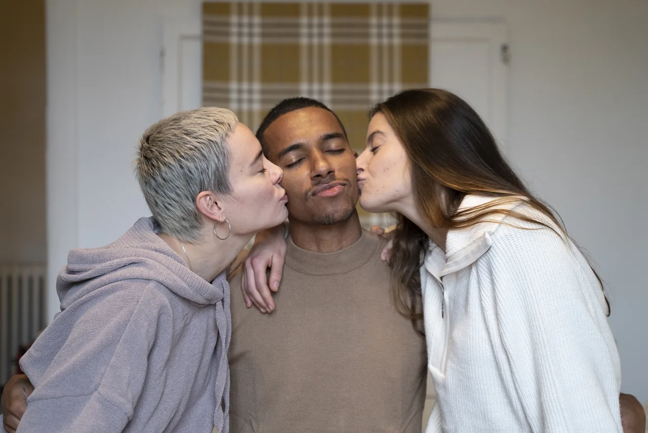 Three adults sharing an affectionate moment, illustrating Herpes Couples Looking for a Third Partner