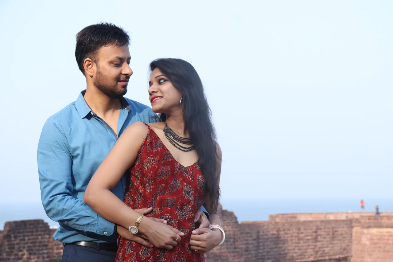 Two adults standing together beside the sea, illustrating Bilingual Herpes Dating and Clear Connection